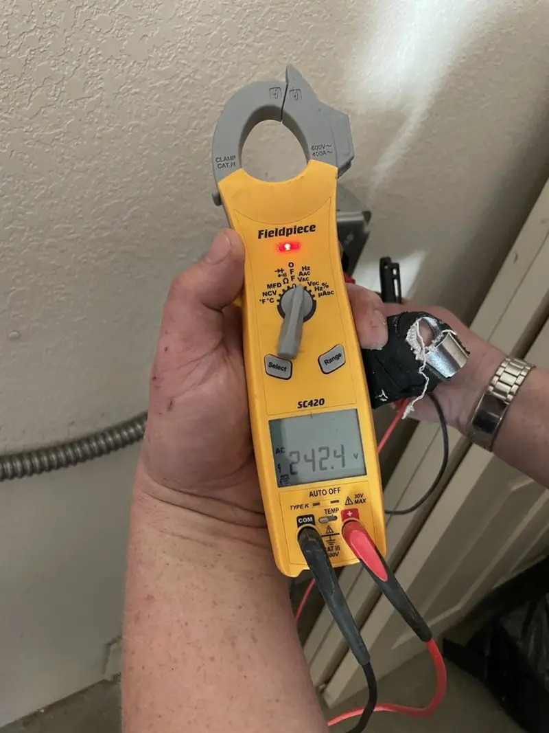 Voltage testing with clamp meter during Whole House Surge Protector in Salt Lake City